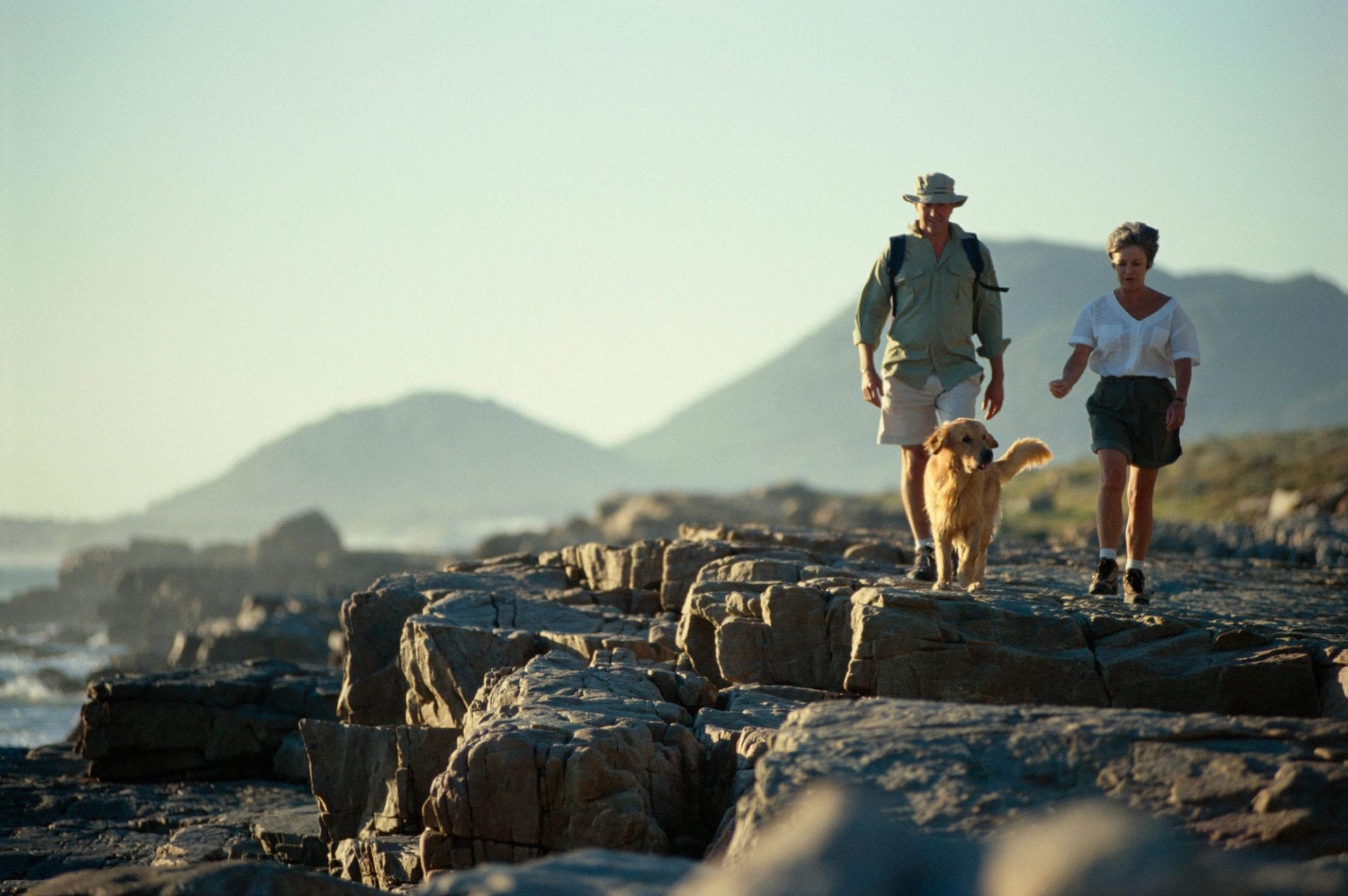 a man and a woman with a dog